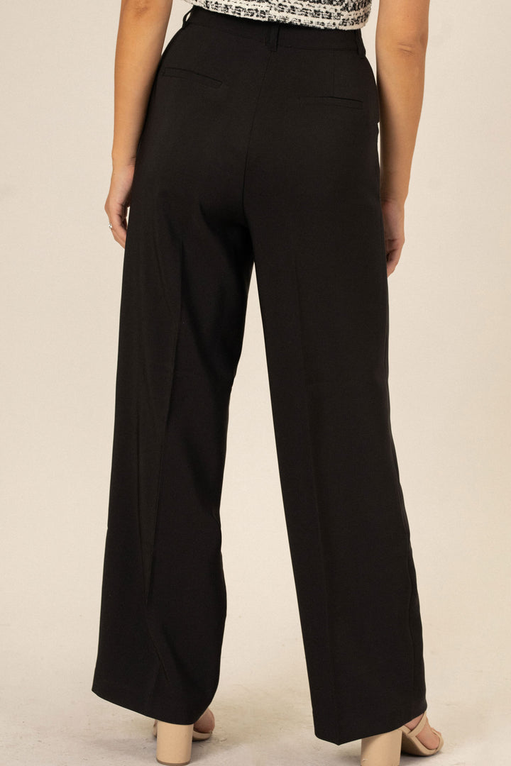 High-rise black wide-leg pants with a sleek, tailored silhouette.