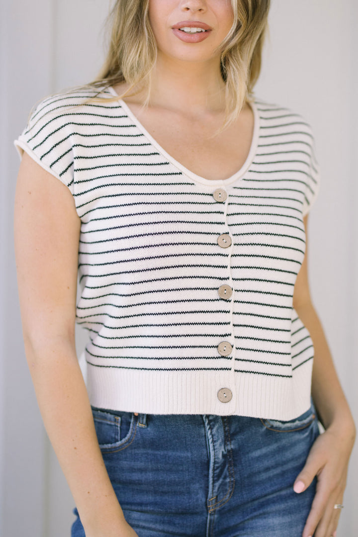 A striped, short-sleeve cardigan with a scoop neckline, button-down front, and raw edge trim.