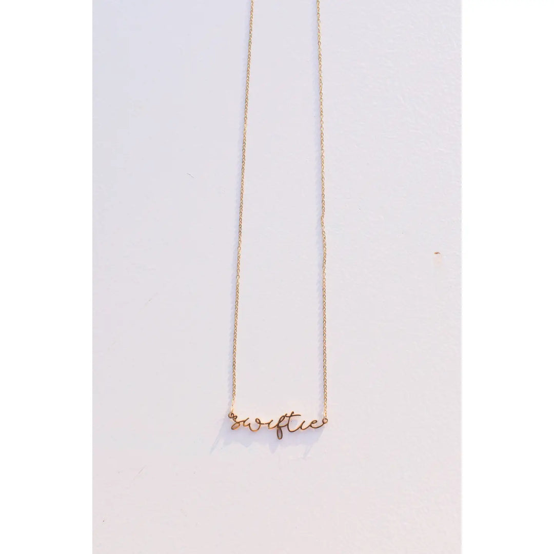 18K gold plated necklace with "Swiftie" script pendant on delicate chain.