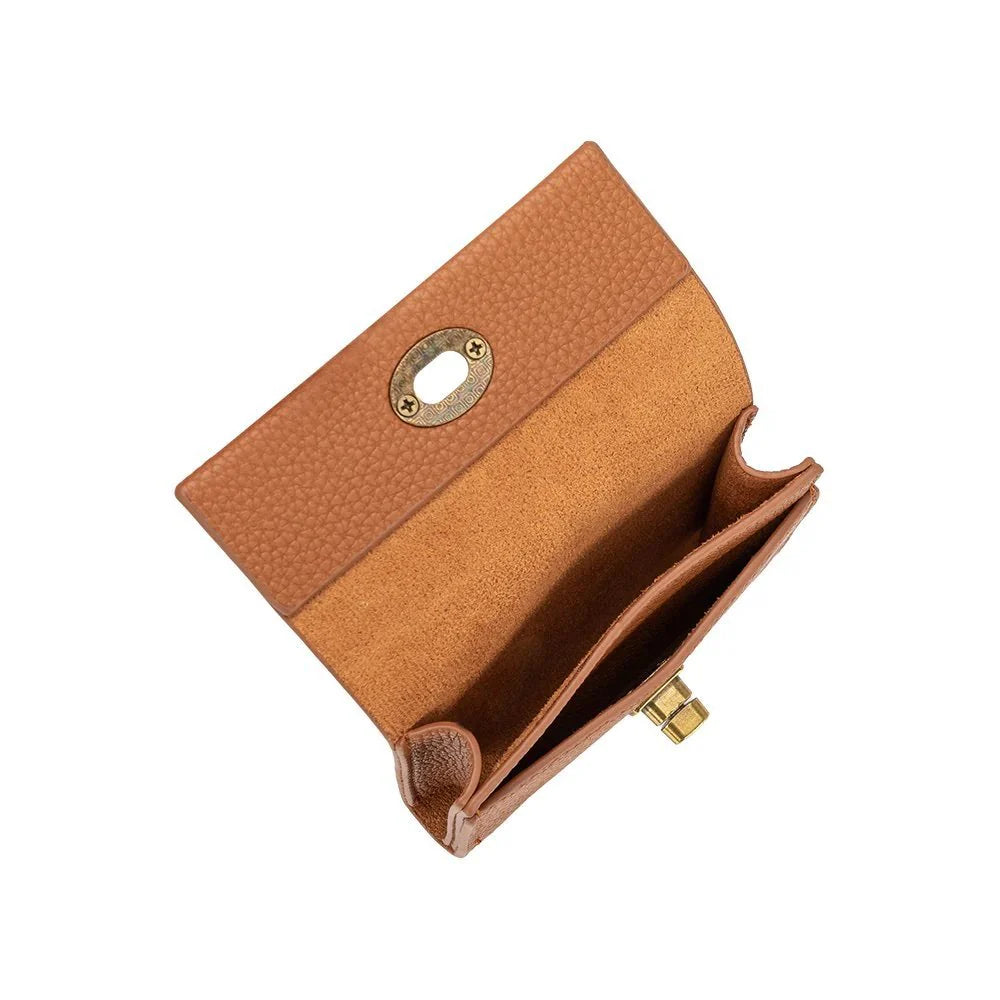Tan vegan leather wallet with turn-lock closure, brass hardware, and two card slots.