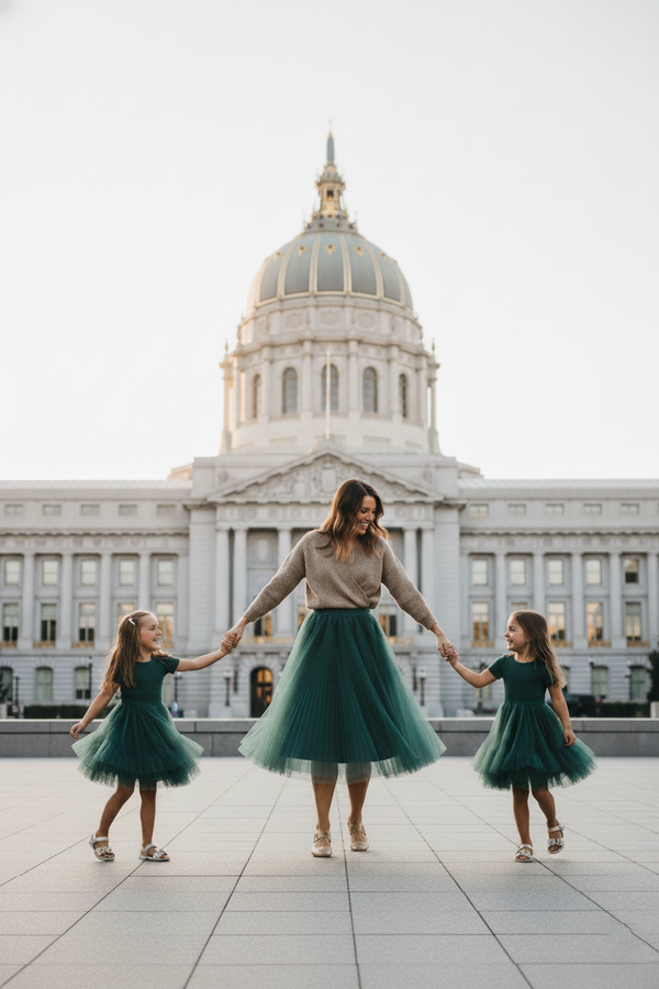 woman in vienna tulle skirt and girls in ribbed tulle dress in front of sf city hall family photo