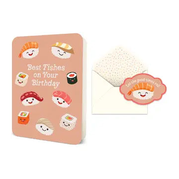 Peach-colored birthday card featuring kawaii sushi and fish emojis, with envelope with white polka dot pattern.