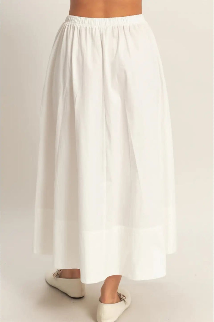 White wide-leg pants on a plain background
