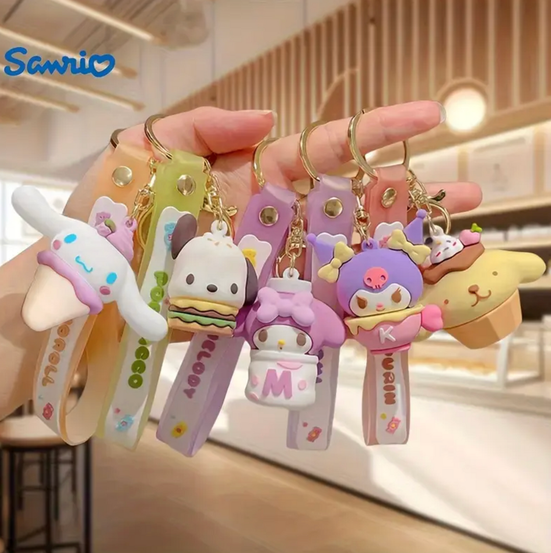 A collection of colorful, pastel-colored character keychains featuring Sanrio characters like Pompompurin, My Melody, and Cinnamoroll, with charms and text accents.