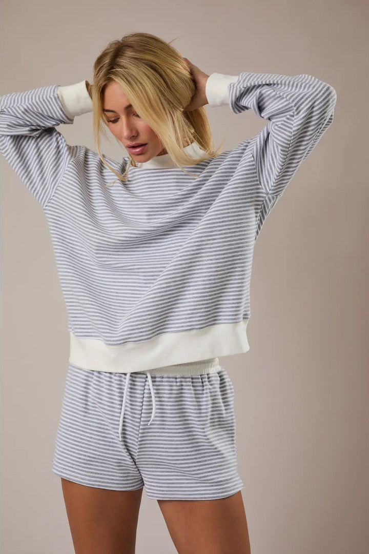 Gray and white striped pullover sweatshirt and matching lounge shorts set with a relaxed, comfortable fit.