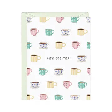 Colorful teacups and mugs patterned with polka dots, florals, and text "Hey, Bee-Tea!" on a white background.