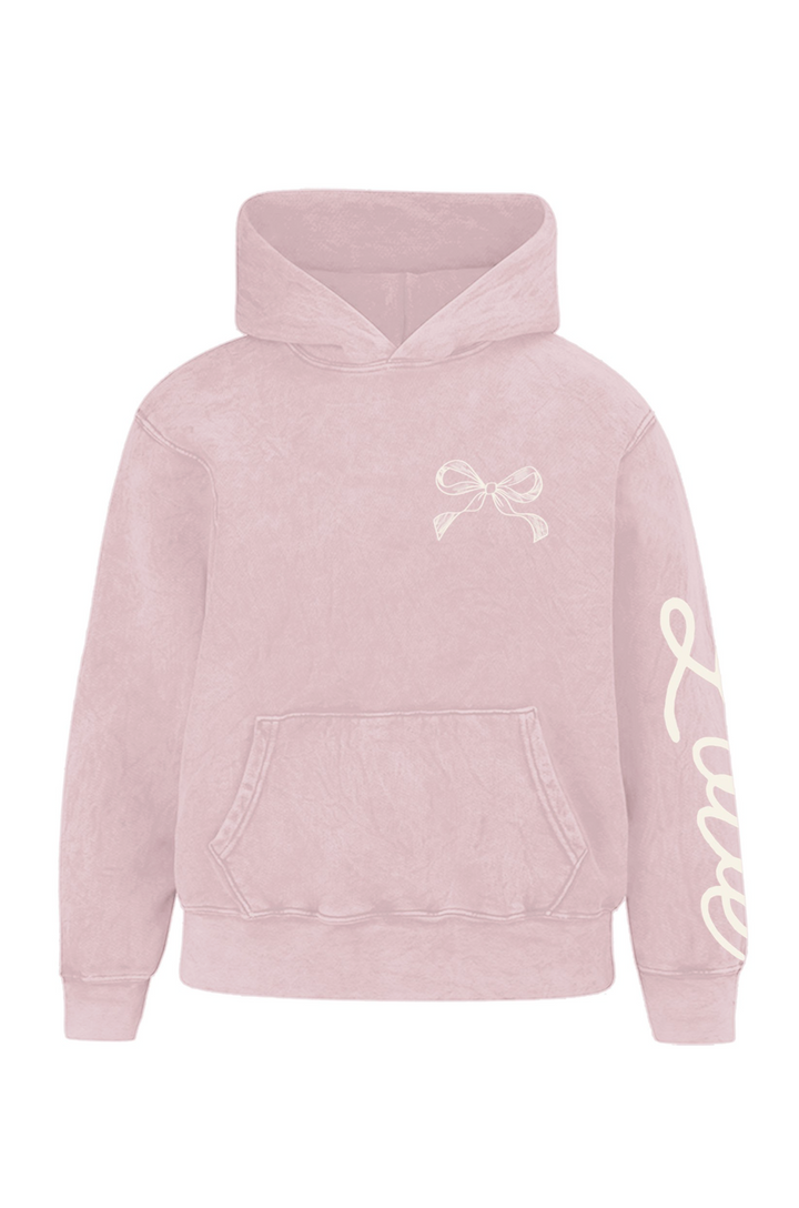 Soft pink hooded sweatshirt with a bow graphic and "Love" text printed on the sleeve.