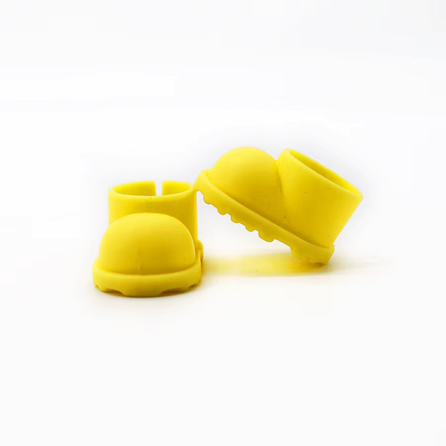 Two bright yellow rain boots with distinctive ridged soles for added traction.