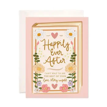 Whimsical floral greeting card with text "Happily Ever After" in ornate gold lettering, surrounded by pink and yellow flowers and heart shapes against a pale pink background.