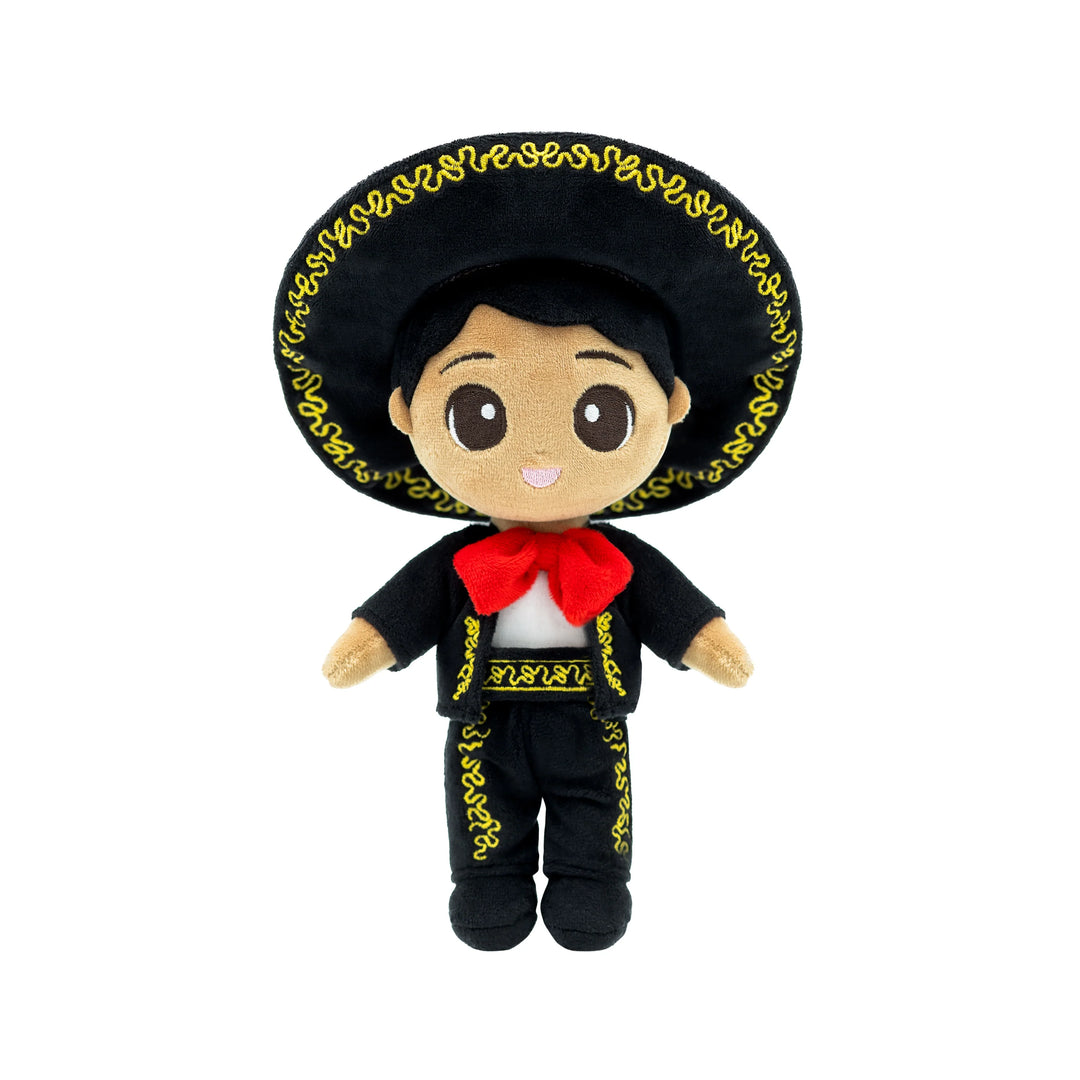 A plush doll wearing a traditional Mexican-inspired costume with a large black sombrero, black outfit with gold embroidered designs, and a red scarf.
