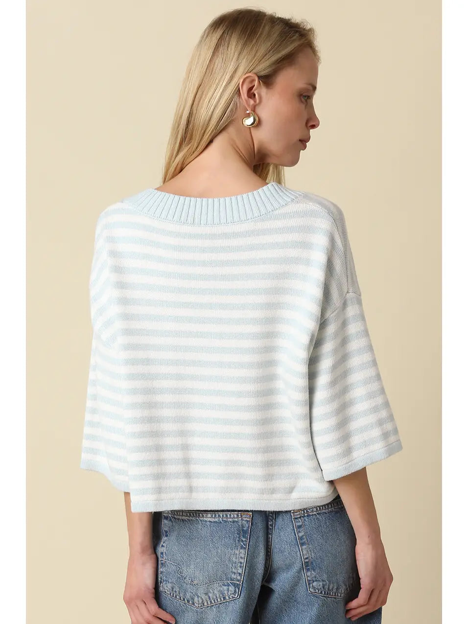 A loose, lightweight knit top with white and gray striped pattern, featuring a boat neckline and 3/4 length dolman sleeves.
