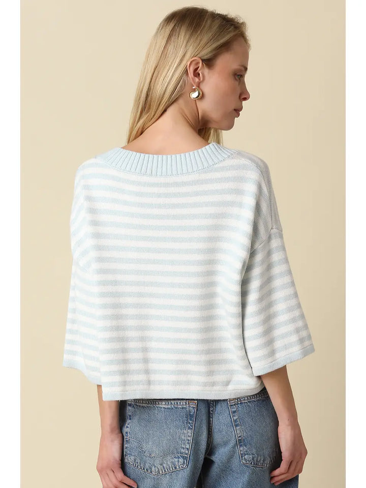 A loose, lightweight knit top with white and gray striped pattern, featuring a boat neckline and 3/4 length dolman sleeves.