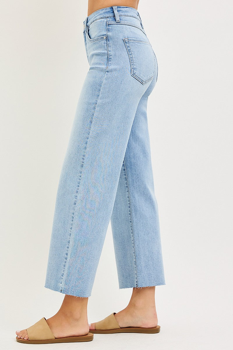 High-rise cropped wide-leg jeans in light blue denim with a tummy-control design.