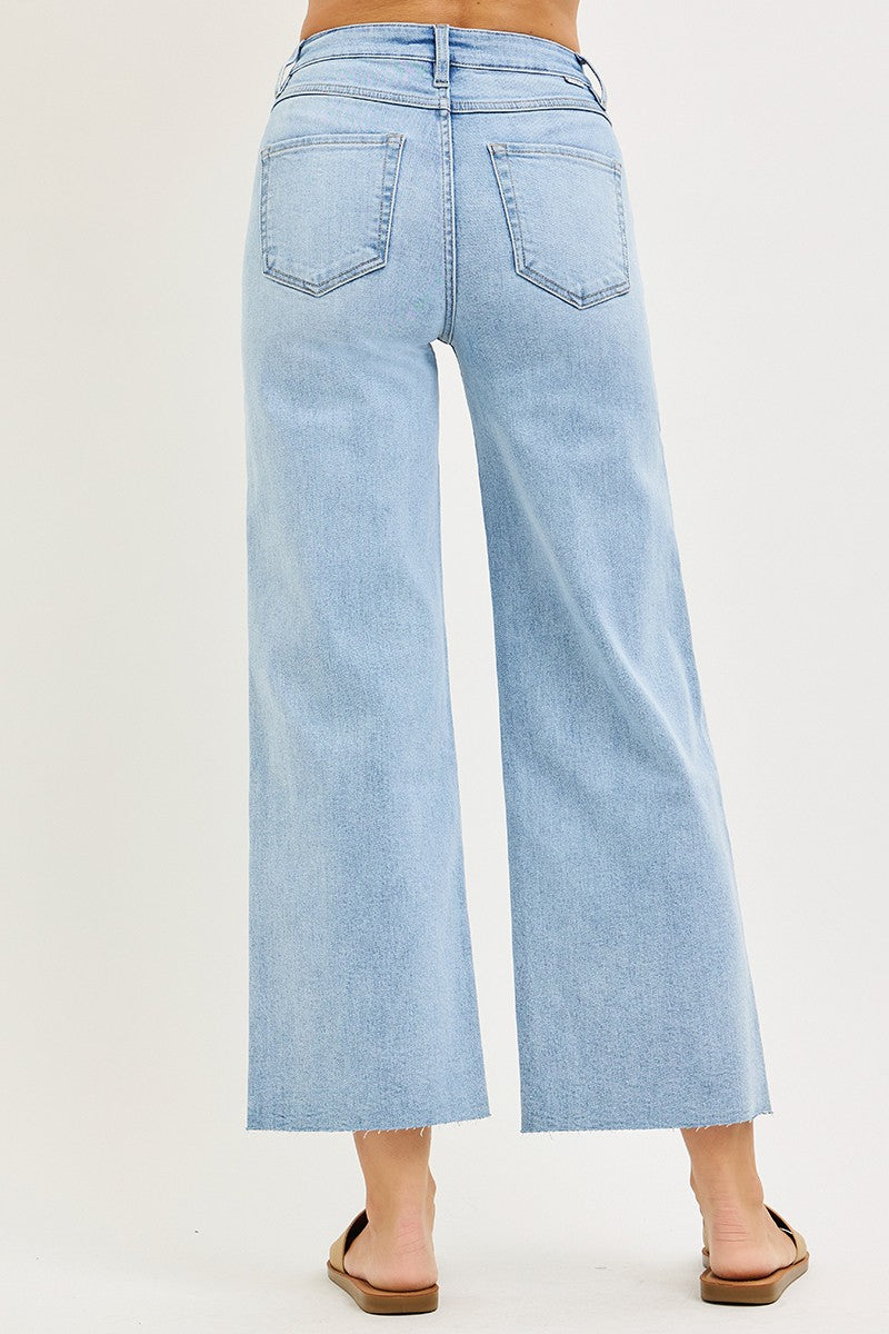Light blue high-waisted cropped wide-leg denim jeans with pockets on the back.