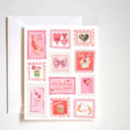 A collection of pink and red greeting cards featuring a variety of heart, ribbon, and stamp designs.