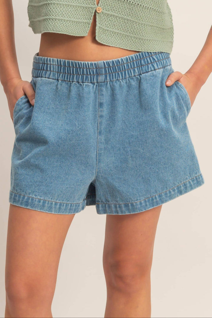Light blue elastic-waisted denim shorts with a relaxed, casual fit.