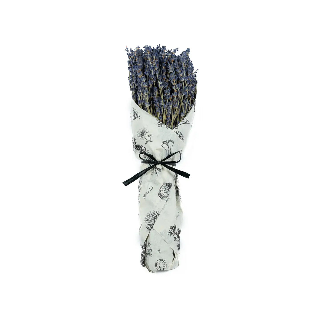 Tightly wrapped bundle of vibrant purple lavender flowers, elegantly presented in a patterned paper wrap with a black ribbon tie.