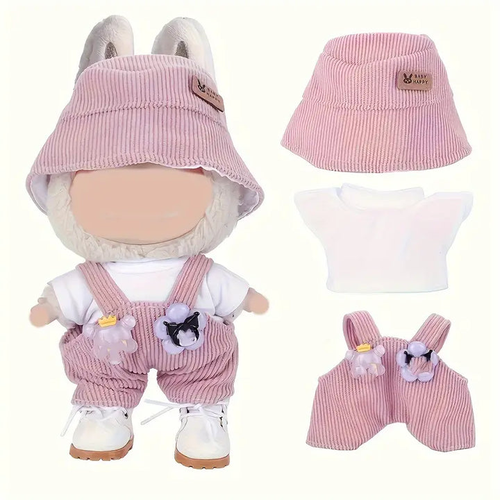 Pink corduroy overalls with floral accents, matching pink bucket hat, and soft plush doll with large eyes and ears.
