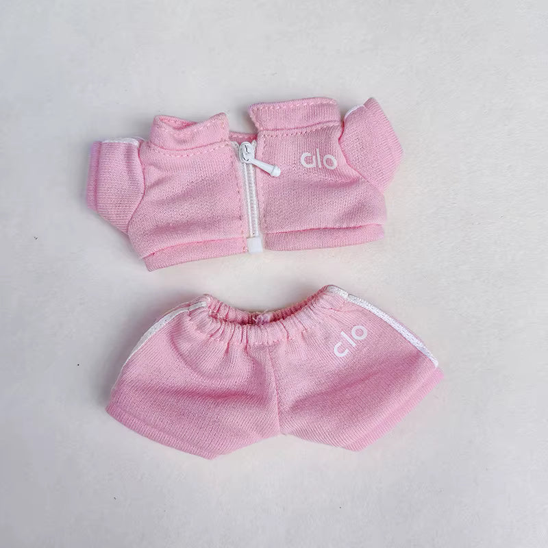 Pink knitted Alo-branded jacket and shorts set for an infant or toddler.