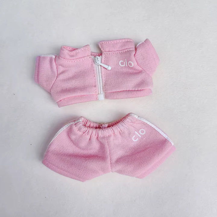 Pink knitted Alo-branded jacket and shorts set for an infant or toddler.