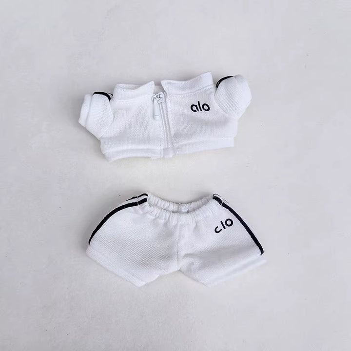 White sports set with zippered jacket and matching shorts, featuring the "Alo" logo.