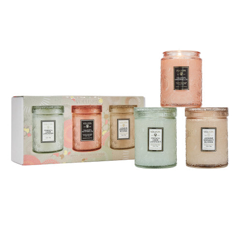 A set of 3 small, colorful glass jar candles in various pastel shades with metallic lids, presented in a gift box.