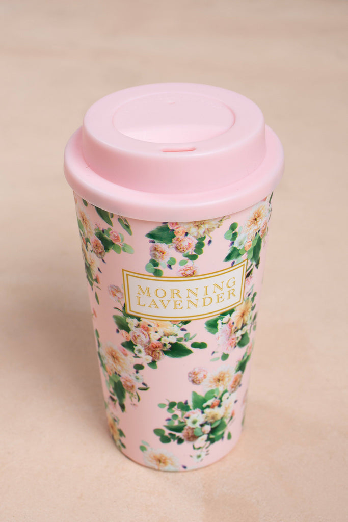 Small flower in Lavazza milk bottle Travel Mug by mayina