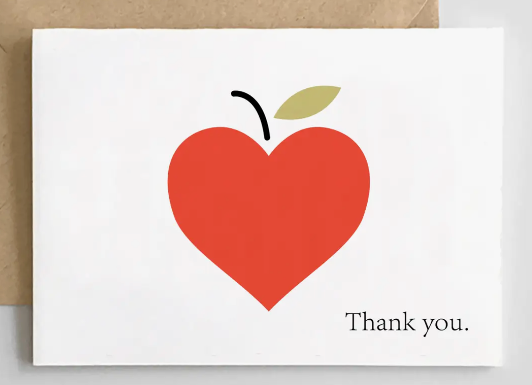 A simple, minimalist greeting card with a large red heart-shaped apple and the text "Thank you." on a white background.